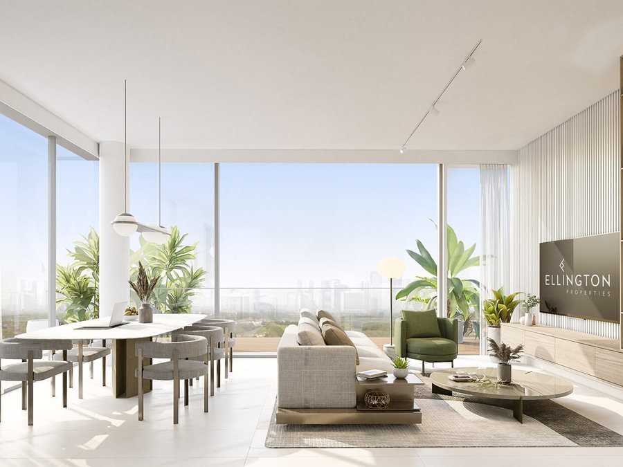 Apartment interior at Ellington Villas Dubai — open-plan living and dining with floor-to-ceiling glazing, fluted timber joinery and a planted terrace beyond